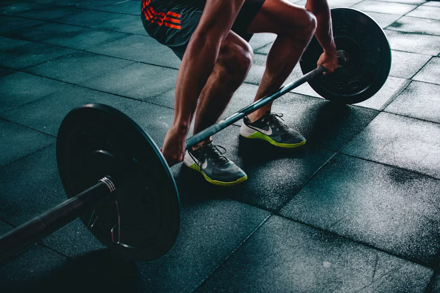 Trainer coaching a client in a fitness studio